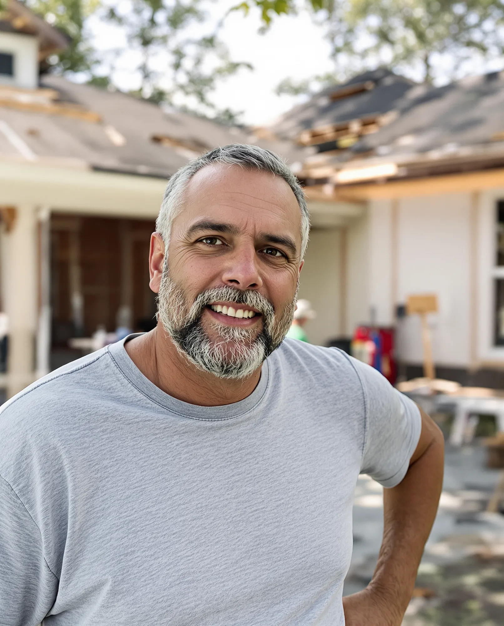 An established roofing company owner at a residential jobsite