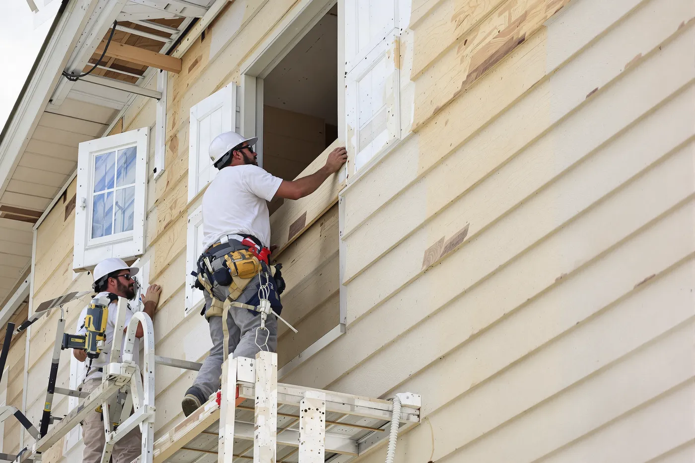 A siding crew on the job in the market you would own.